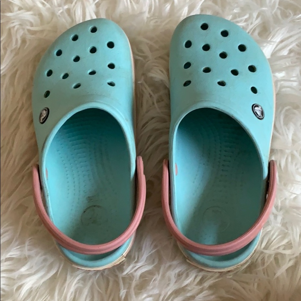Blue, pink, and white Crocs